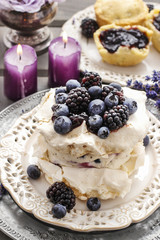 Pavlova cake with blueberries and blackberries