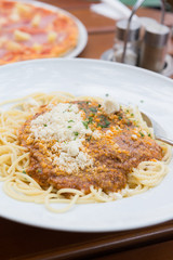 Spaghetti bolognese with parmesan cheese. Selective focus.
