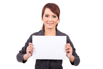 Naklejka premium Happy smiling young business woman holding blank signboard, over white background