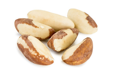Close-up of several brazil nuts isolated on white background.