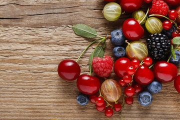 Delicious fruits on wooden background