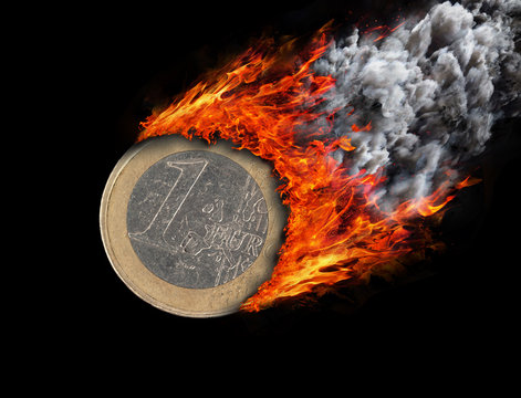 Burning Coin With A Trail Of Fire And Smoke