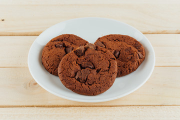 soft dark chocolate brownie cookies on wood