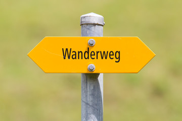 Bergwanderweg sign in the mountains, navigation for hikers