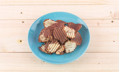 potato chip with chocolate on wood