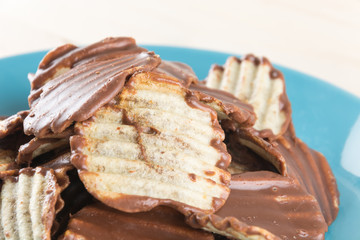 potato chip with chocolate on wood
