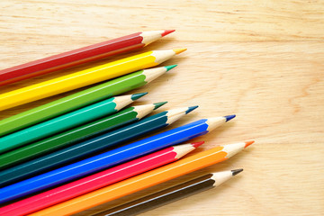 Color pencils on wood background