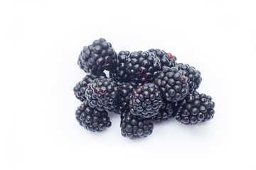 Fresh sweet blackberries with leaves isolated on white, selective focus