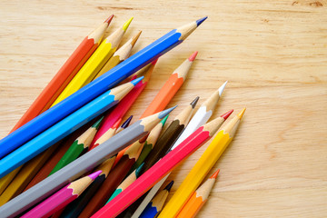 Color pencils on wood background