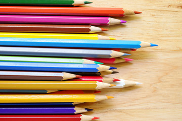 Color pencils on wood background