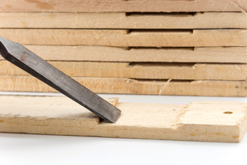 chisel with wood on white background