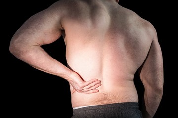 Naklejka premium Strong bodybuilder with painful back
