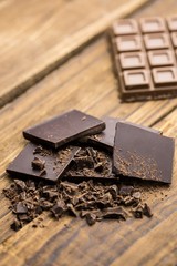Dark and milk chocolate on a wooden table