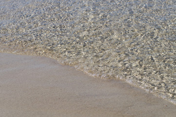 Soft wave of the sea on the sand beach