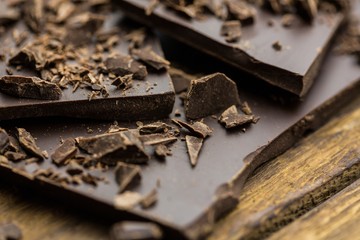 Pieces of chocolate on a wooden table