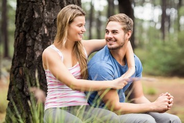 Young happy hiker couple looking at each other