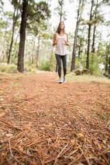Young happy jogger walking
