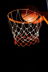 Fototapeta premium Basketball hoop on black background with light effect
