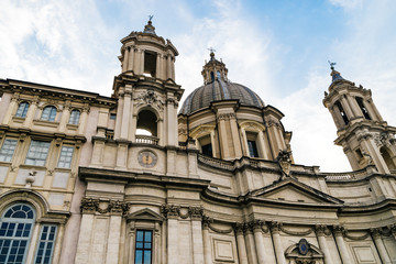 Fototapeta na wymiar Saint Agnese in Agone in Piazza Navona at cloudy sky, Rome, Italy