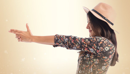 Woman making gun gesture