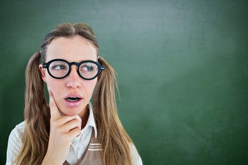 Composite image of female geeky hipster looking confused 