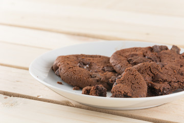 soft dark chocolate brownie cookies on wood