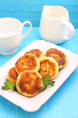 Syrniki (Cottage cheese pancakes, Fritters of cottage cheese) traditional Ukrainian and Russian cuisine.