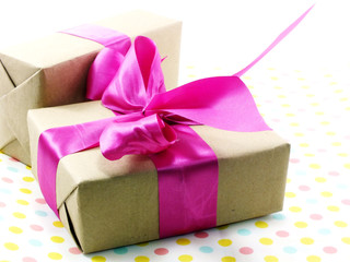 gift box wrapped in recycled paper with ribbon bow