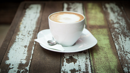Coffee cup top view on old wooden