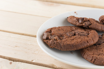 soft dark chocolate brownie cookies on wood