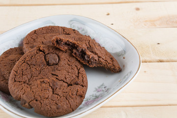 soft dark chocolate brownie cookies on wood