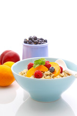 muesli (granola) with berries and yogurt for breakfast