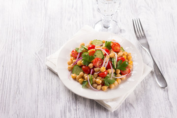 Healthy chickpeas salad with vegetables