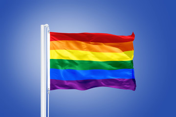 Rainbow flag, sun, wind, and blue sky