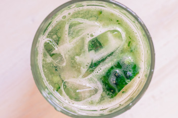 Cucumber water with ice in a glass