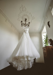 Bride's wedding dress in a stylish fashionable interior