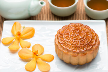 Mooncakes. Traditional Mooncake and hot tea - Chinese moon cake