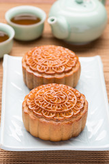 Mooncakes. Traditional Mooncake and hot tea - Chinese moon cake