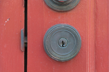 Door Handles on red wood door