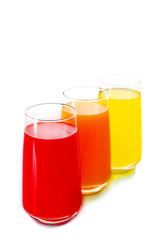 Glasses of different juice isolated on white
