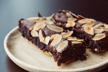 chocolate brownies on wood plate