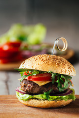 Delicious burgers with beef, tomato, cheese and lettuce
