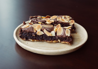 chocolate brownies on wood plate