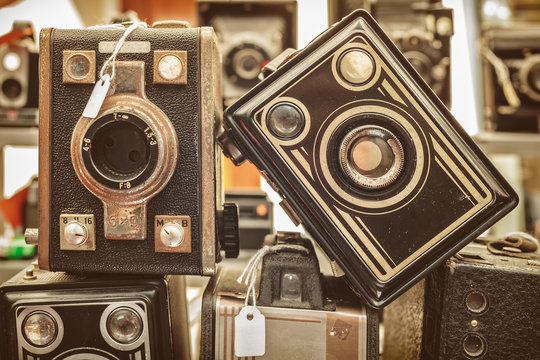 Sepia toned image of old box cameras