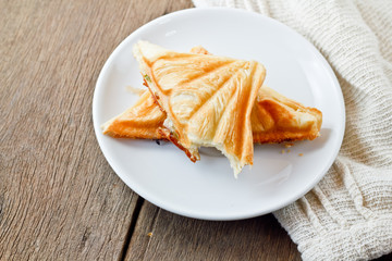Tuna puff. Tuna sandwich on wood table.