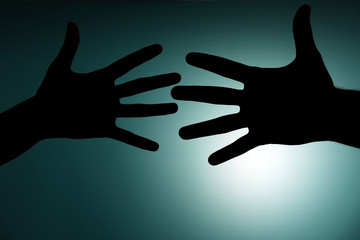 Silhouette of hands close up