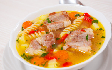 soup with meat, pasta and vegetables