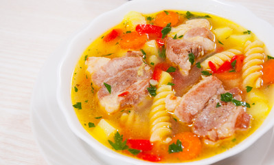soup with meat, pasta and vegetables