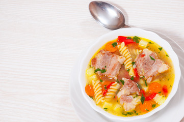 soup with meat, pasta and vegetables