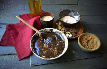 Preparing dough for chocolate pie on table close up